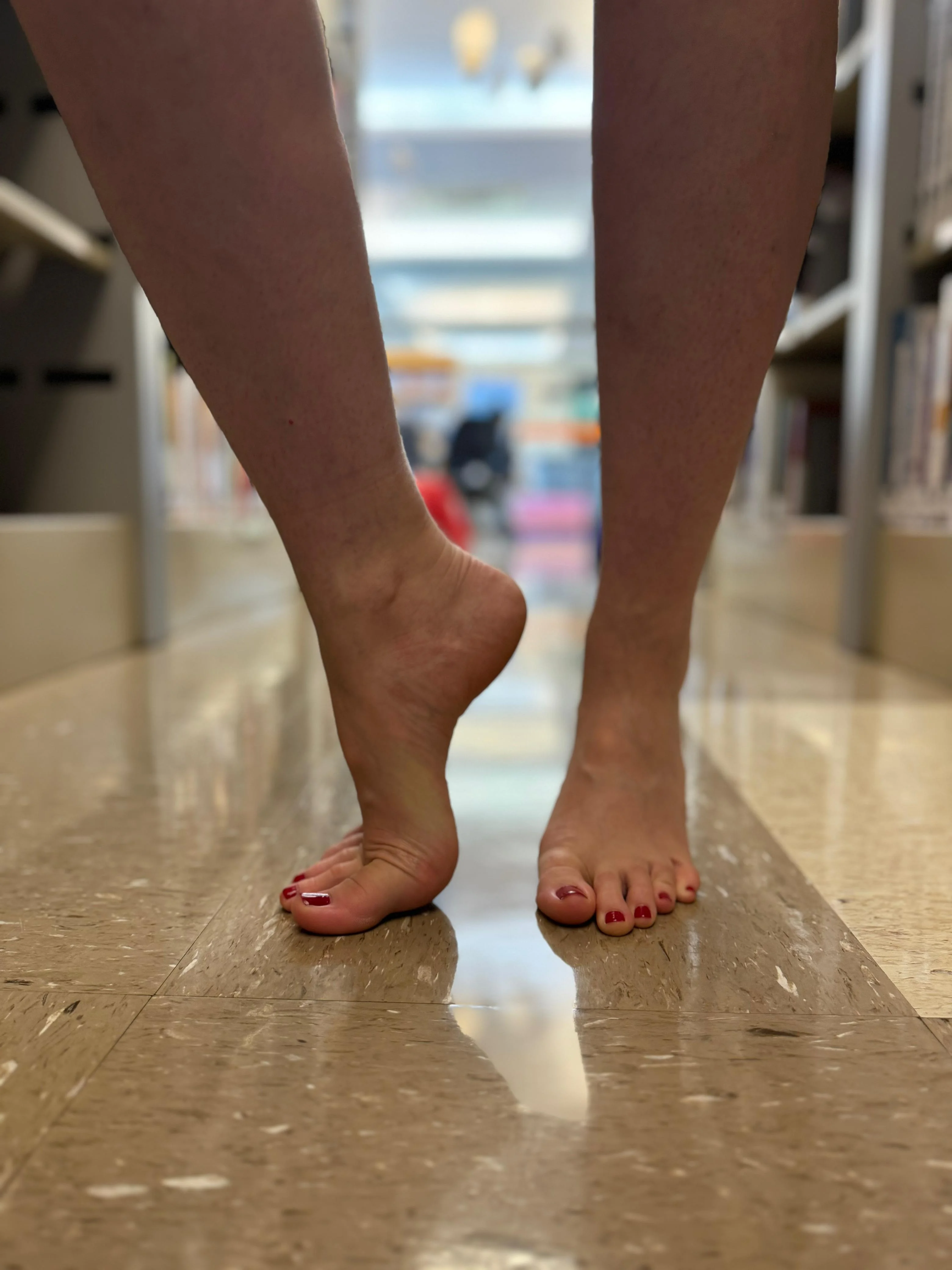 On tiptoes in the library picture 2 of 3