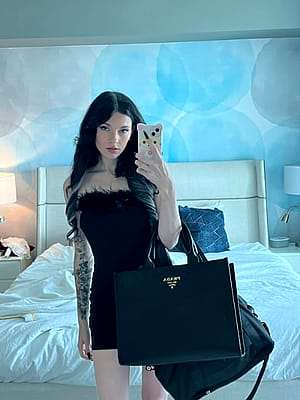 Do I look nice in black dress?'