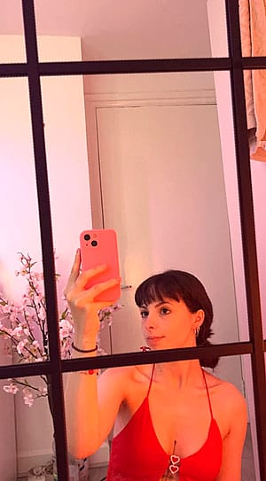This red top suits well on my pale skin'