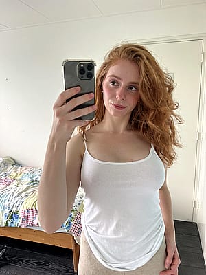 Red hair, red lips, and endless charm'