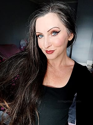 classy black top and simple hair'