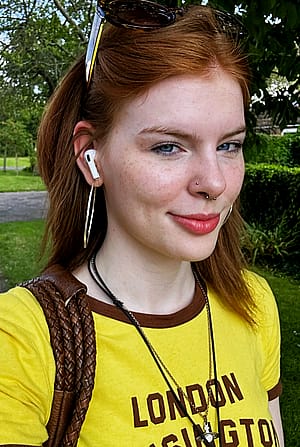 white girl with freckles and striking blue eyes'