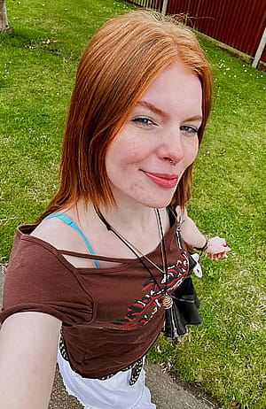 Red hair, don't care. Standing out like a sunset in a world full of neutrals.'