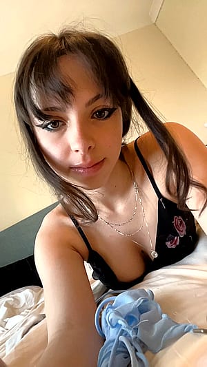 white girl in black with make up on'