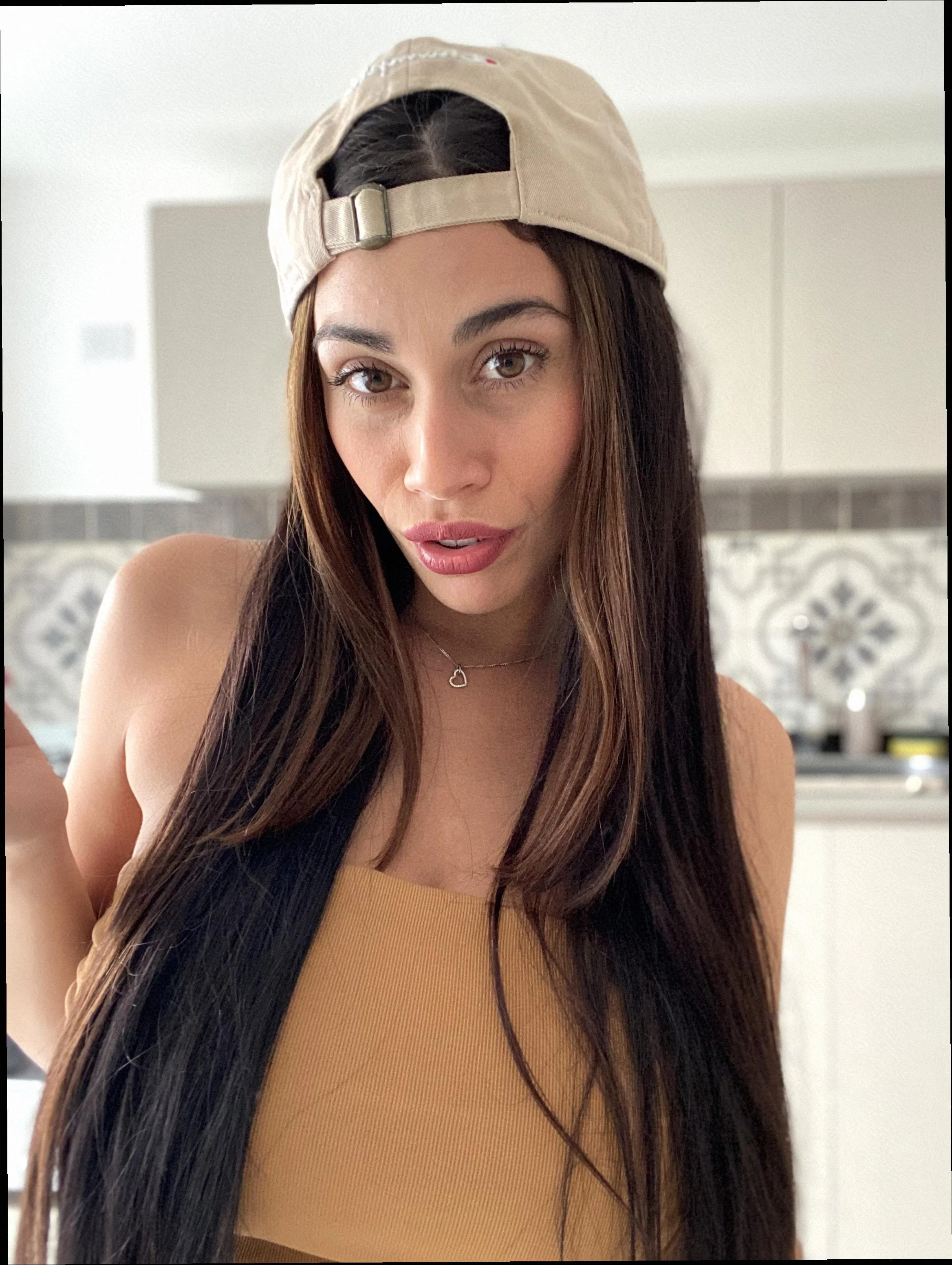 Hats off? Nah, I think it stays on for this look. What do you think picture 1 of 1