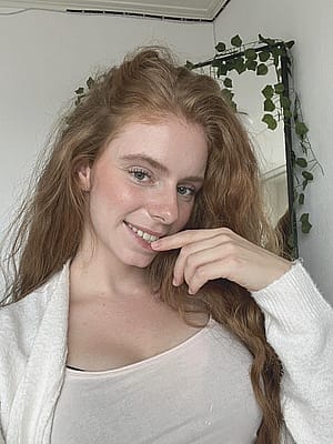 A fiery muse, naturally radiant.'