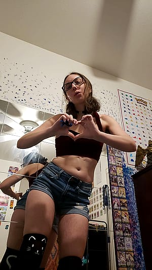 Looking sexy in this red velvet halter top (and the cat thigh high socks really add to the allure)'