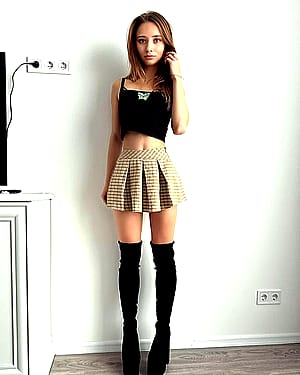 Who would've thought a school girl like me would look good in knee high heels'