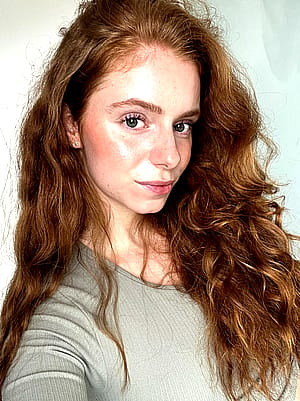 Pale tones with fiery presence.'