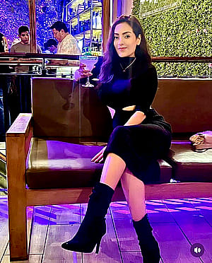 I look very classy and sassy because of this slit on my black dress, I love flaunting it'