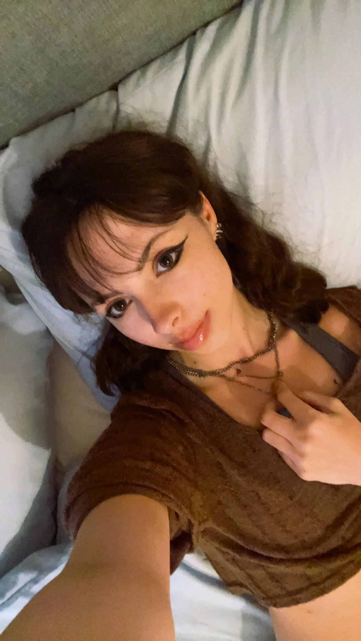 college girl is lying back down again after getting ready picture 1 of 1